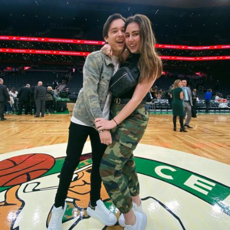 Elijah Hendrix Wahlberg and Grace Adduci took a picture at a Celtics game in 2019.